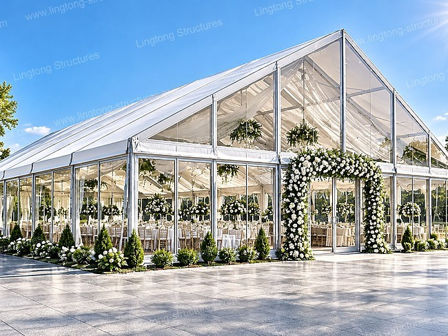 Clear glass wall wedding marquee on lawn for luxury outdoor wedding event