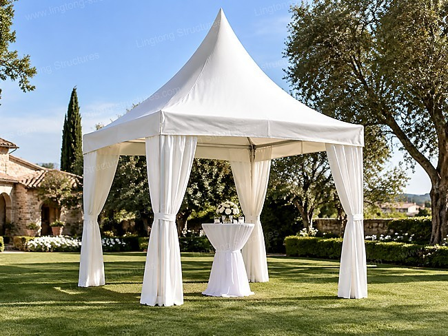 Connected double pagoda tents with drapes for outdoor event