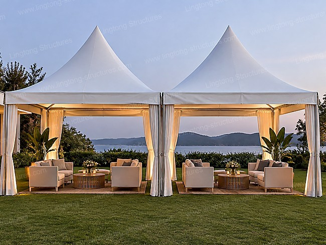 Connected double pagoda tents with drapes for outdoor event