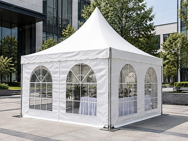 Connected double pagoda tents with drapes for outdoor event
