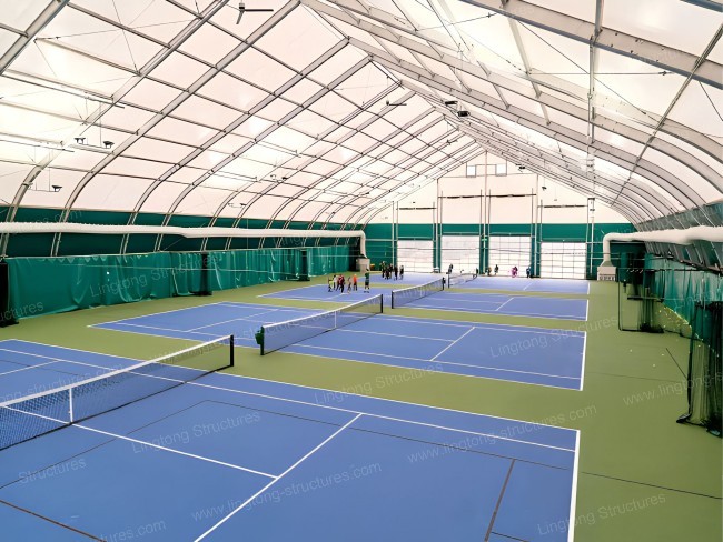 Sports tent used for badminton court with clear PVC sidewalls for natural light