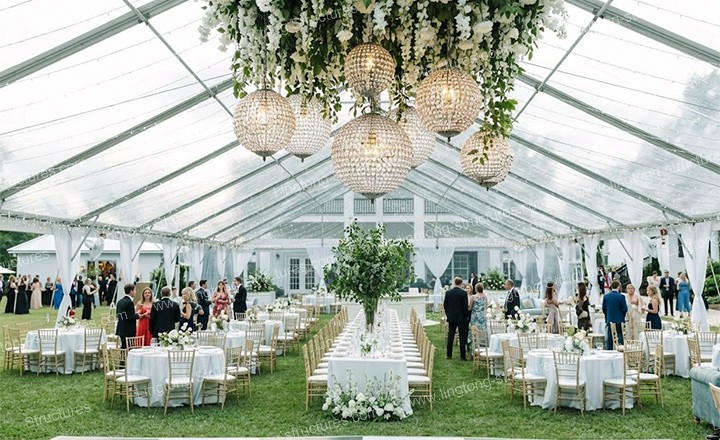 9781787903220466.jpg Luxury wedding marquee with wooden flooring and elegant table setting for formal reception