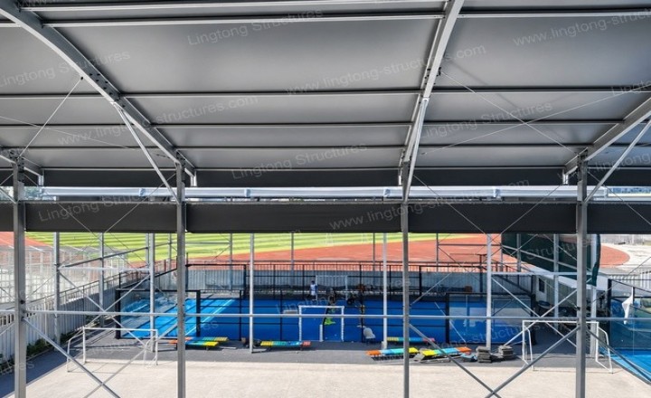 181788939270491.jpg Interior view of the covered padel courts showing playing surface and LED floodlighting system
