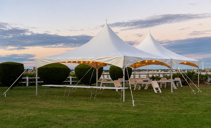 Commercial pagoda tent with multi-tiered roof set up for outdoor events