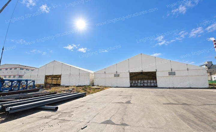 Two coal yard enclosure structures side by side